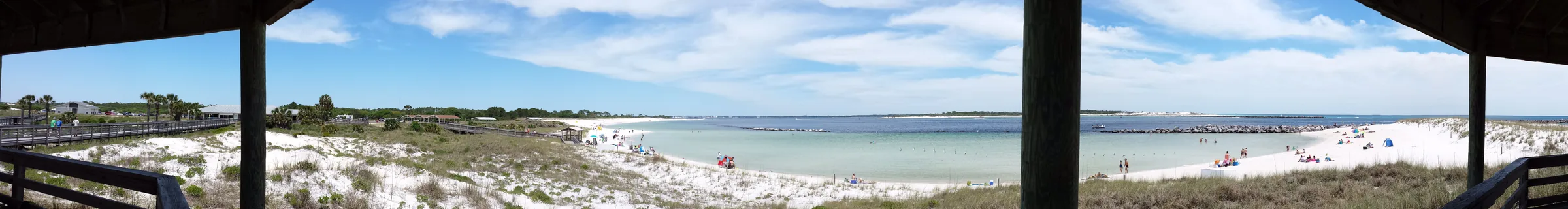 Panoramic view from a shaded pavilion toward the jetties beach at St. Andrews State Park.